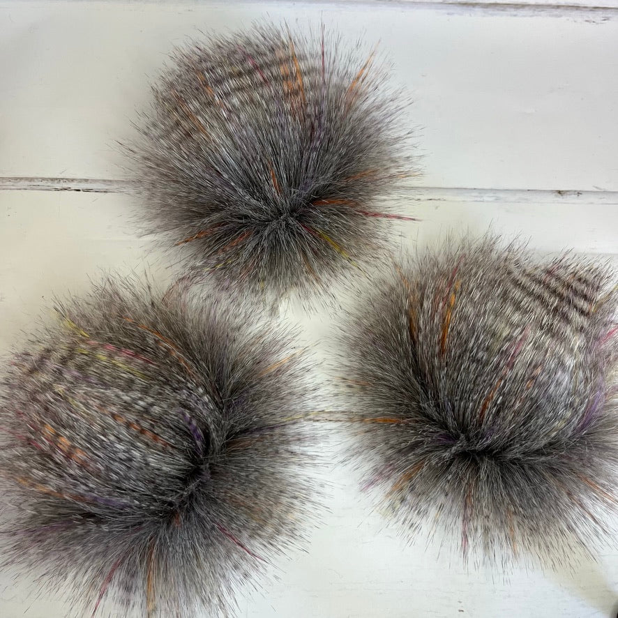 Sunburst coloured faux fur pom pom. Detachable option. Handmade