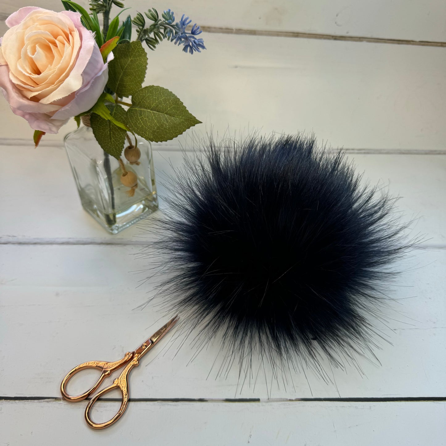 Navy handmade faux fur pom pom. Detachable option