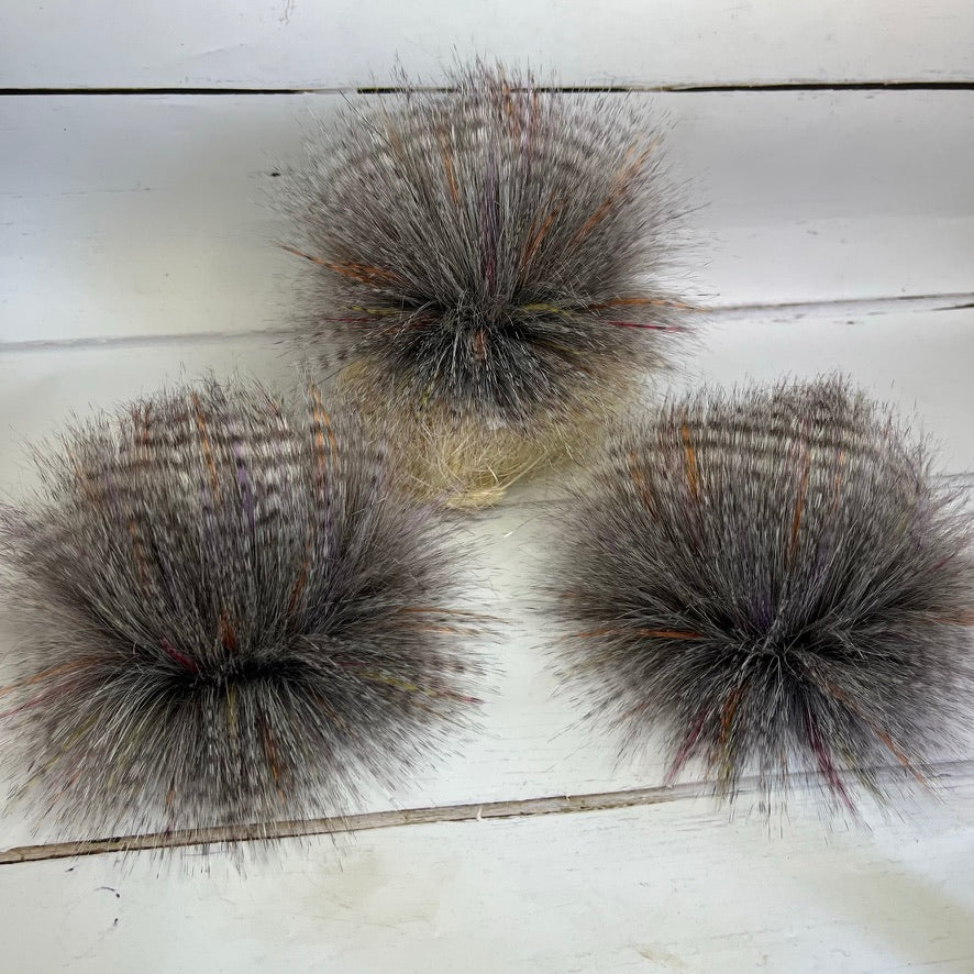 Sunburst coloured faux fur pom pom. Detachable option. Handmade