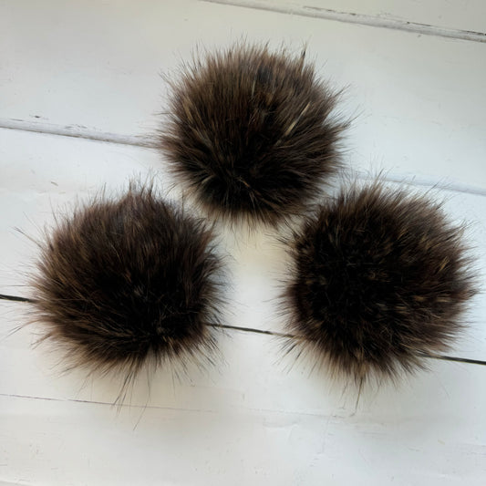 Walnut coloured faux fur pom pom