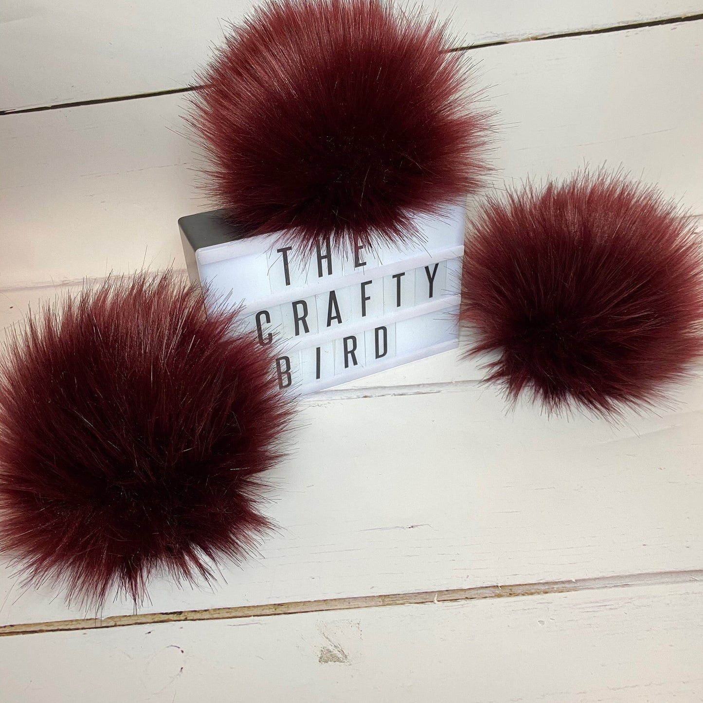 Burgundy faux fur pom pom