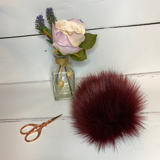 Burgundy faux fur pom pom