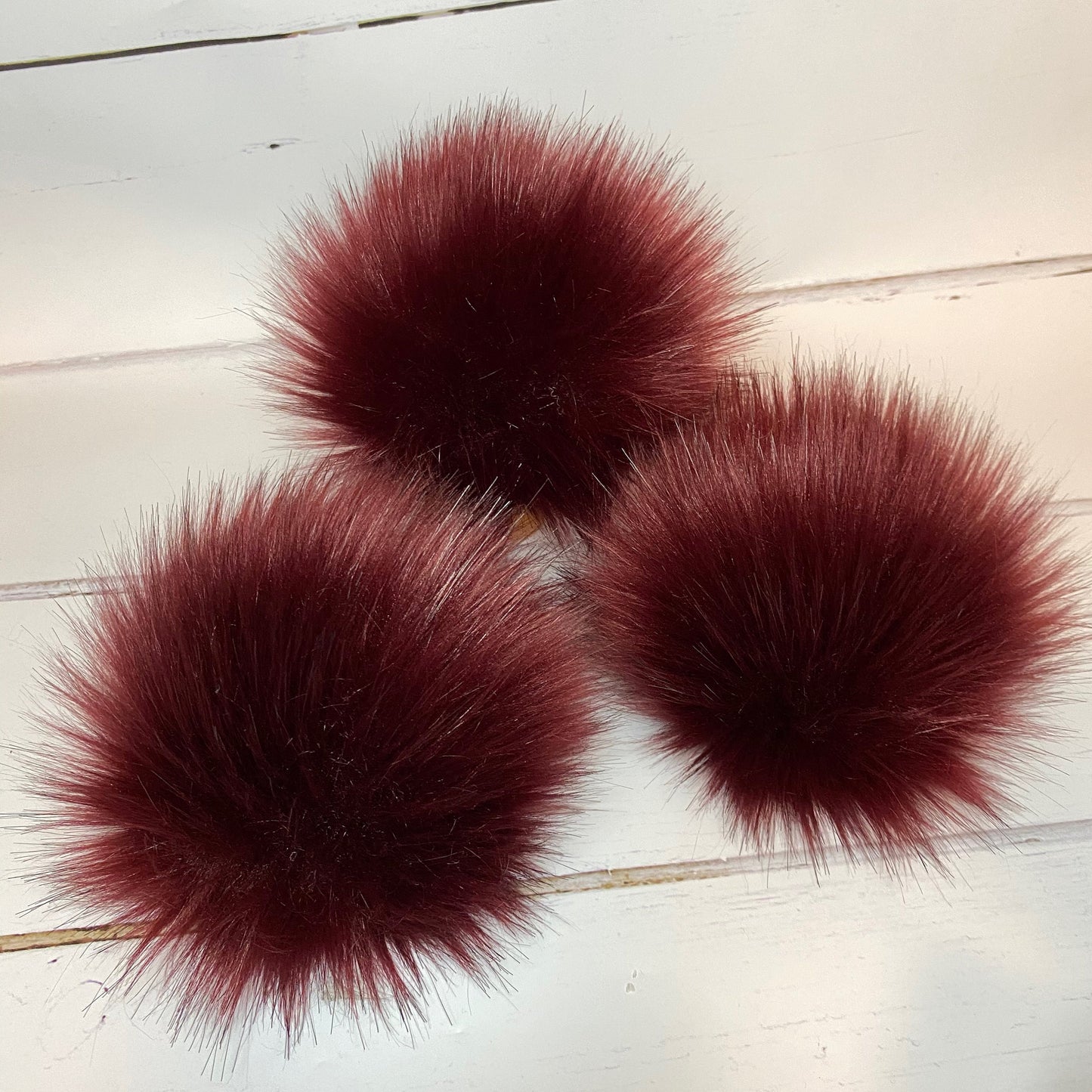 Burgundy faux fur pom pom