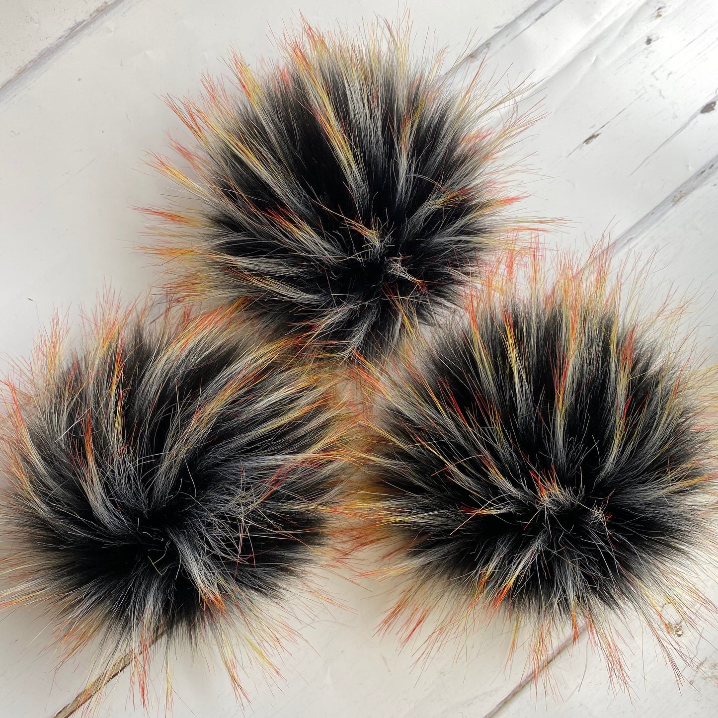Blackbird handmade faux fur pom pom. Detachable option. Handmade
