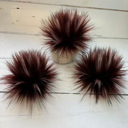 Redwood coloured faux fur pom pom. Detachable option. Handmade
