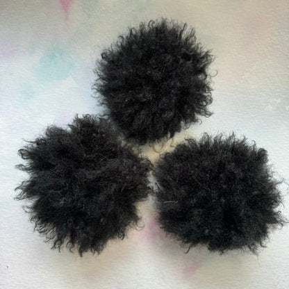 Black faux alpaca handmade faux fur pom pom. Detachable option