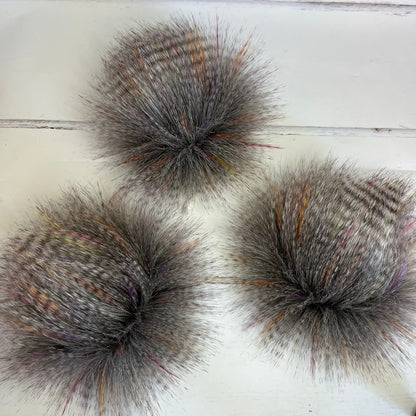 Sunburst coloured faux fur pom pom. Detachable option. Handmade