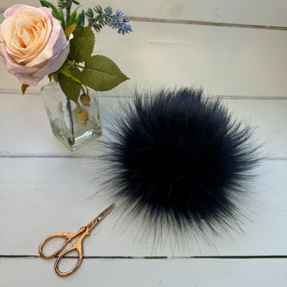 Navy handmade faux fur pom pom. Detachable option