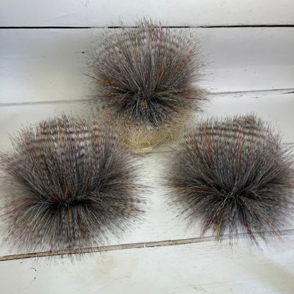 Sunburst coloured faux fur pom pom. Detachable option. Handmade