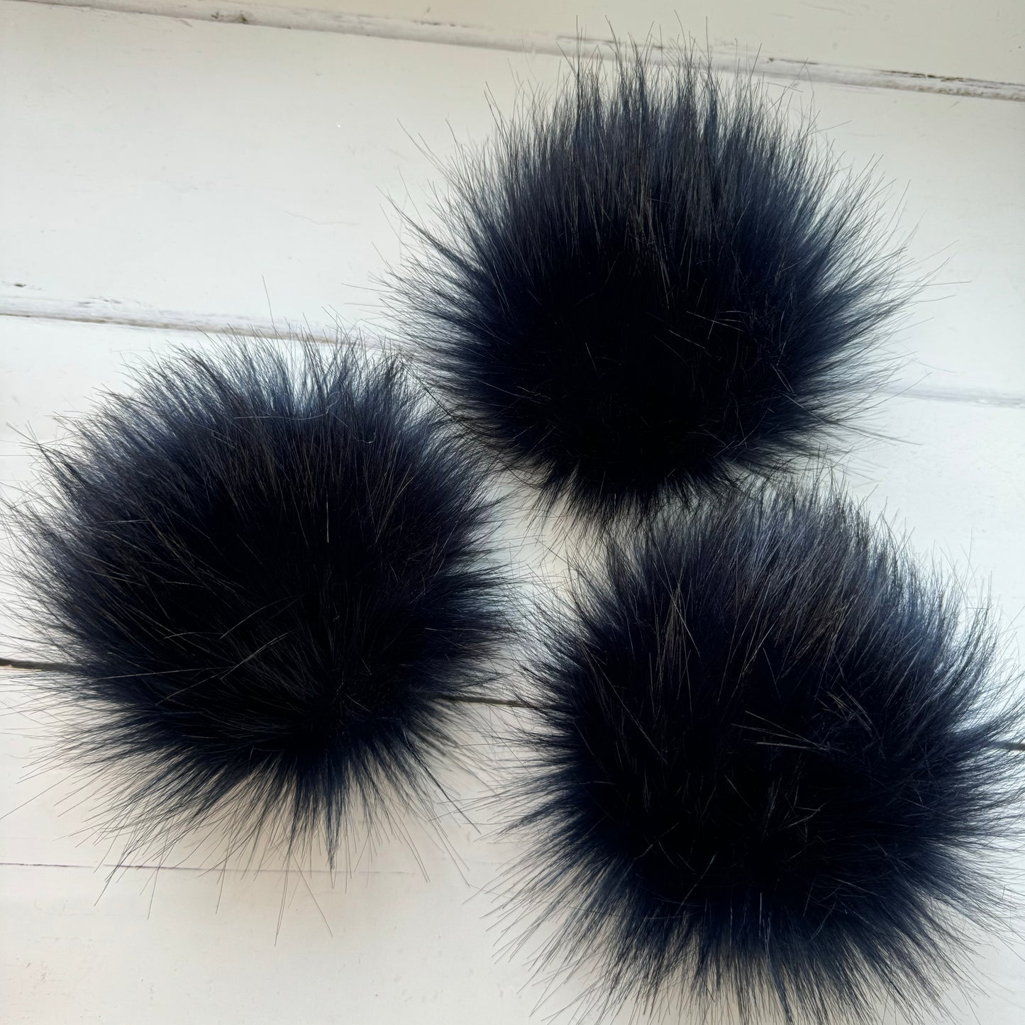 Navy handmade faux fur pom pom. Detachable option