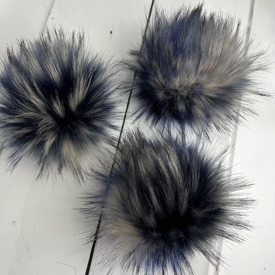 Speckled blue and cream and black handmade faux fur pom pom. Detachable option. Handmade