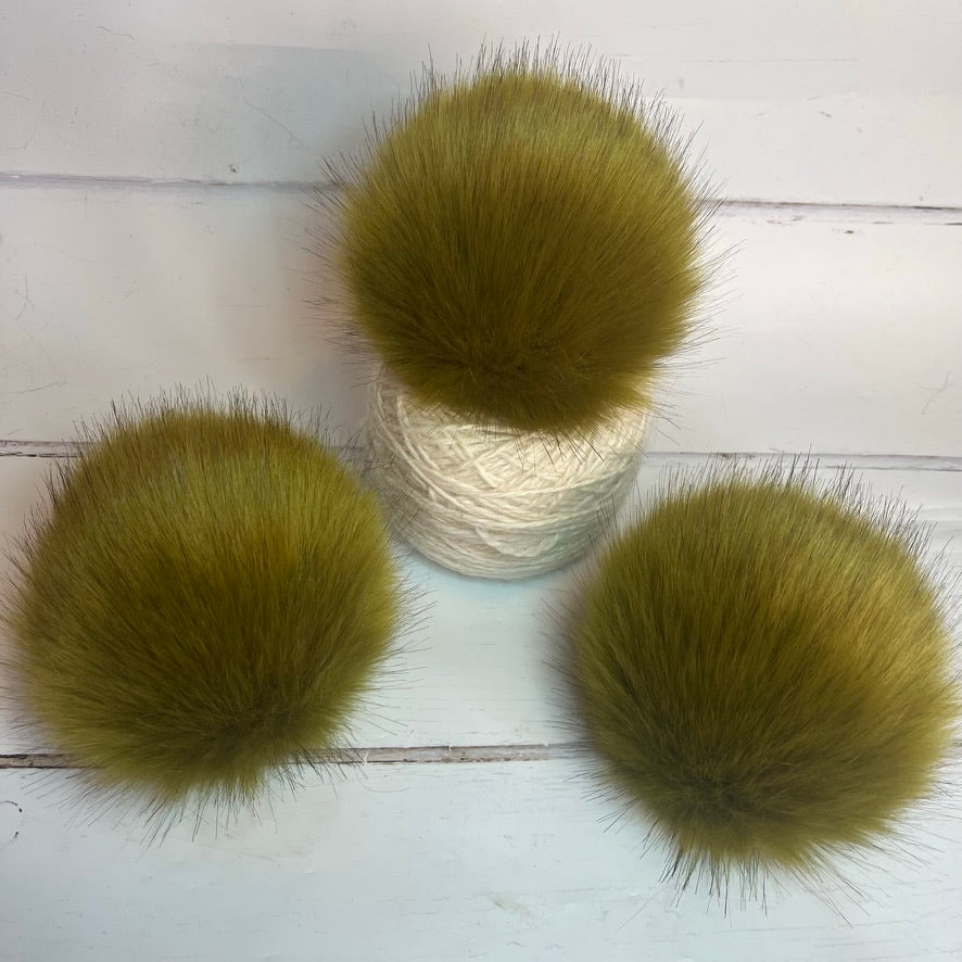 Lime coloured faux fur pom pom. Detachable option. Handmade