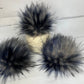 Speckled blue and cream and black handmade faux fur pom pom. Detachable option. Handmade