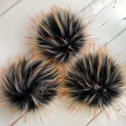 Blackbird handmade faux fur pom pom. Detachable option. Handmade