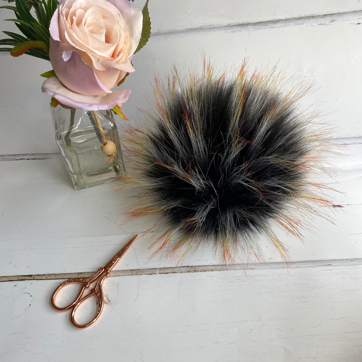 Blackbird handmade faux fur pom pom. Detachable option. Handmade