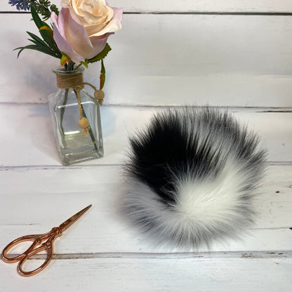 Cruella faux fur pom pom. Detachable option