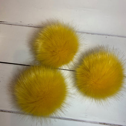 Ochre coloured faux fur pom pom. Detachable option. Handmade